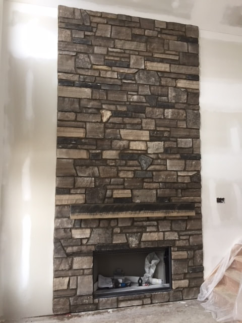 OLD WORLD LIMESTONE FIREPLACE